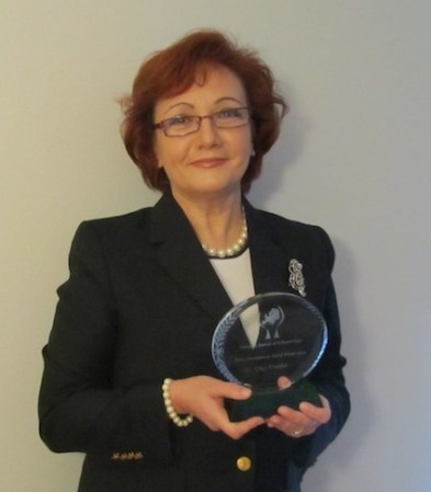 Winner of the 2014 EJPC Palliative Care Policy Development Award: Dr Olga Usenko with her award